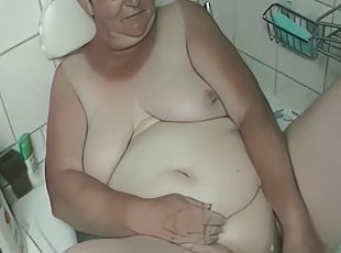 Fat German granny puts candles in her pussy, shaves and plays on the mans cock