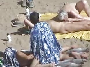 Kinky couple doesn't feel shy while making love on a nude beach