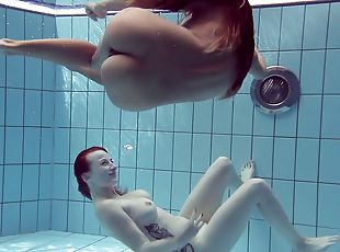 Pair of Russian lesbians exposing their sexy bodies in the pool