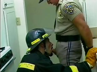 A handsome and wild police officer gives a passionate blowjob in the office