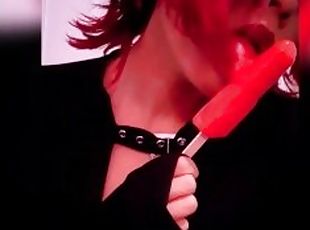 Goth babe licking & sucking red blowpop