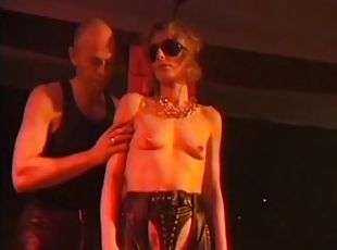 Leather girl bound and flogged in the club