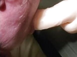 Wife sucking dildo while getting fucked