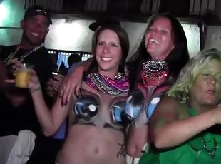 Mardi Gras party girls with painted tits