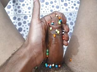 Masturbating with a chocolate dick decorated with Smarties. Wow, how delicious this rooster is ????????